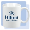Hilton 11-ounce C-handle white ceramic coffee mug with blue Hilton logo.